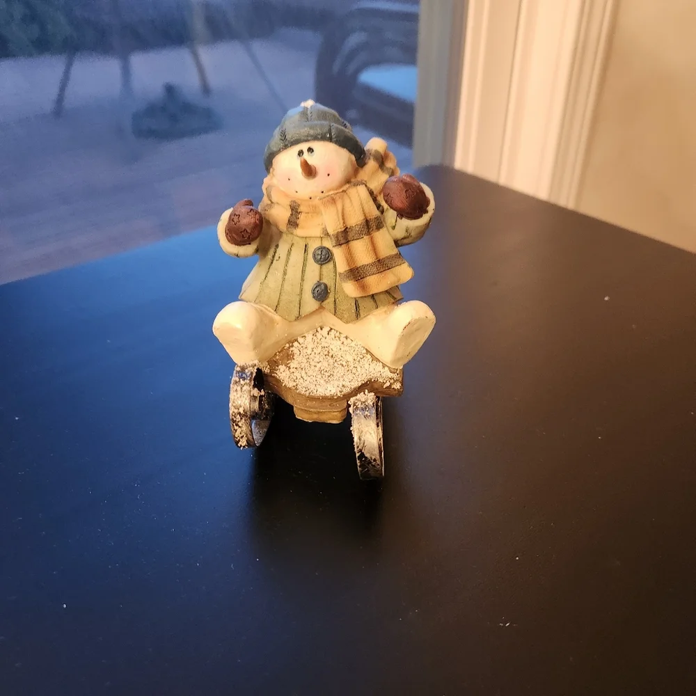 Sledding Snowman Figurine